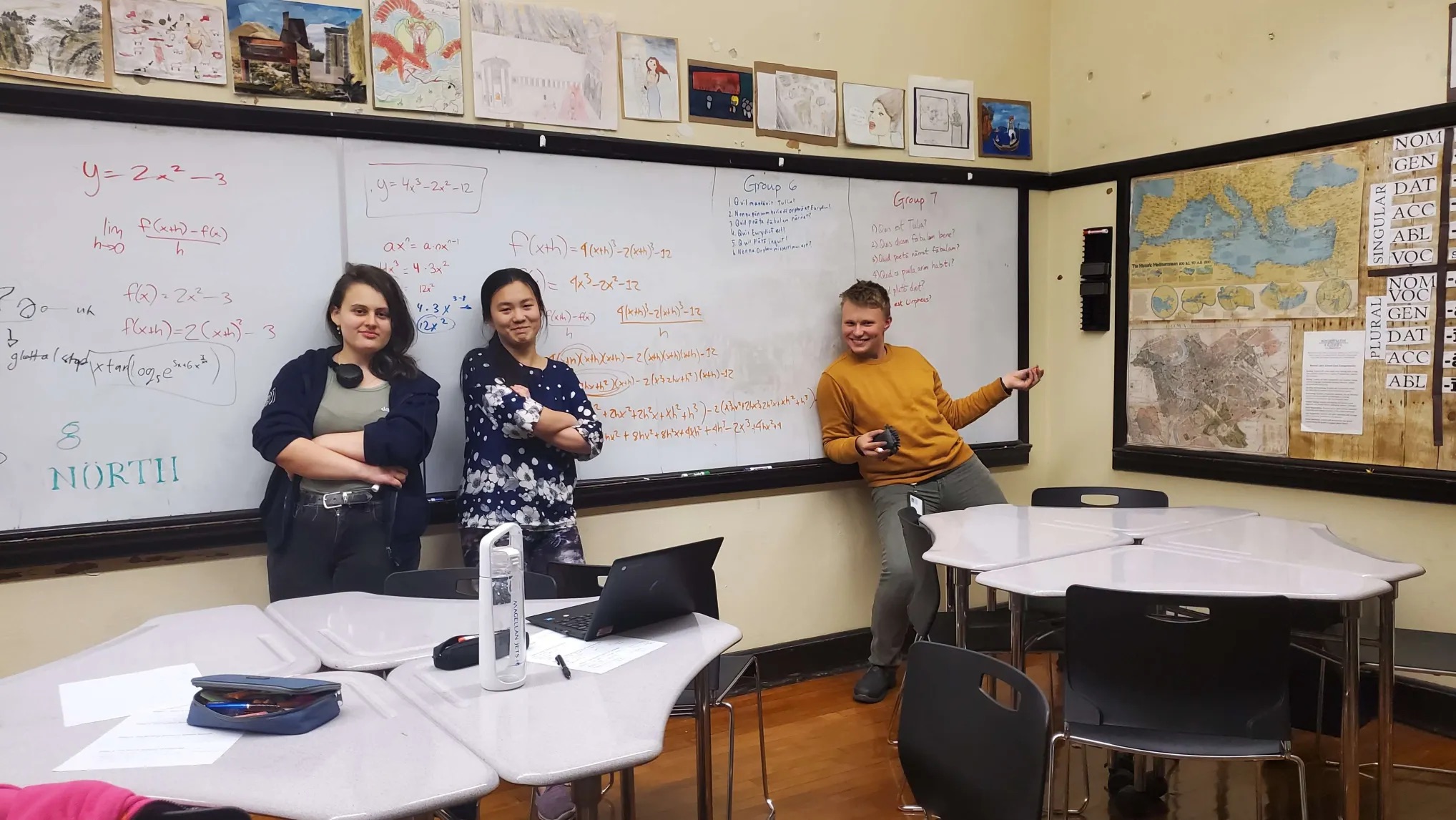Aleksa, Caroline, and Michael in front of the board
